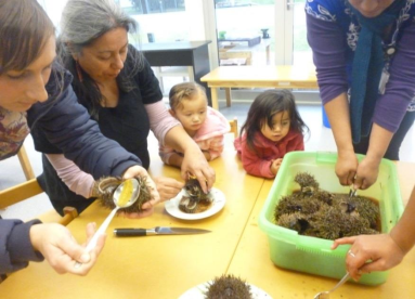 Teachers and youn children preparing Kina