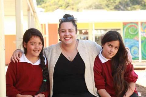 This image shows a mother and her two daughters